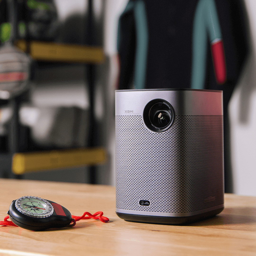 Halo plus 1080p smart projector placed on a wooden table